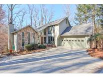 Two-story house with stone accents and attached garage at 740 Marshview Close, Roswell, GA 30076