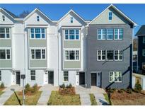 Three-unit townhome building with modern exterior finishes and landscaping at 310 Mcdonough Blvd # 103, Atlanta, GA 30315