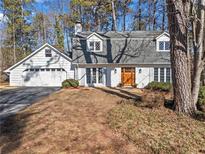 Charming two-story home with gray roof and attached garage at 5371 Tall Oak Dr, Marietta, GA 30068