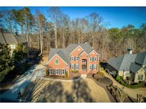 Brick home with a large backyard and mature trees at 5142 Parkwood Oaks Ln, Mableton, GA 30126