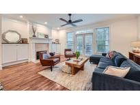Spacious living room features hardwood floors, fireplace, and ample natural light at 213 Knob Hills Cir, Decatur, GA 30030