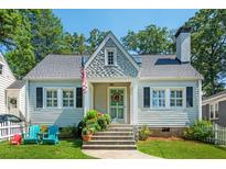 Charming house with gray siding, white trim, and a manicured lawn at 230 Lindbergh Dr, Atlanta, GA 30305