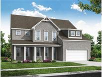 Two-story house with gray brick exterior, front porch, and two-car garage at 6944 Melody Ridge Rd, Buford, GA 30518