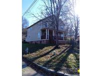 Two-story house with gray siding, brown porch, and a nicely landscaped yard at 1396 Gault Se St, Atlanta, GA 30315
