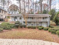 Ranch style home with a large front yard and mature trees at 2212 Oakawana Ne Dr, Atlanta, GA 30345