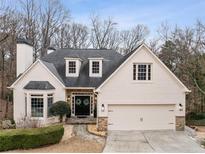 Charming single-Gathering home featuring a well-manicured lawn and a two-car garage at 3730 Ashford Ne Pt, Brookhaven, GA 30319