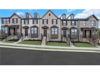 Five attached townhouses with brick exterior, modern features, and landscaped yards at 2010 Fortuna St, Lawrenceville, GA 30046