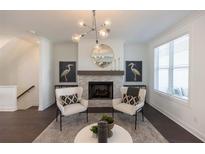 Bright living room features a fireplace and comfortable seating at 5442 Howington Ct # 191, Buford, GA 30518