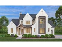 Two-story home features white brick, a gray accent, and a welcoming front porch at 954 Carl Sanders Dr, Acworth, GA 30101