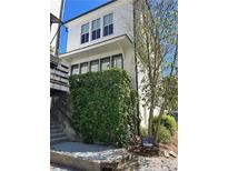 Beautiful two-story home with lush green foliage cascading down the side, adding natural charm at 2057 Telfair Cir, Atlanta, GA 30324