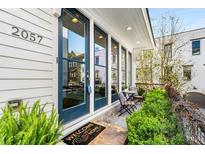 Charming home featuring a welcoming front porch, stone steps, and a 
