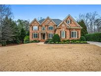 Stunning brick home with a manicured lawn and lush landscaping showcasing curb appeal at 11 Westbrook Dr, Acworth, GA 30101