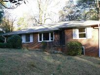 Charming brick home with well-maintained landscaping and a classic design at 1634 Willis Mill Sw Rd, Atlanta, GA 30311