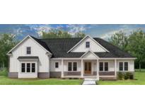 White farmhouse exterior with gray roof and landscaping at 300 Eminence Peak, Rydal, GA 30171