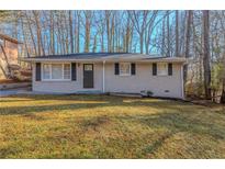 Ranch style home with a freshly painted exterior and a well-maintained lawn at 404 Utoy Sw Cir, Atlanta, GA 30331