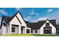 Stunning two-story home with a white exterior, black roof, and manicured lawn at 153 Palisade Dr, Rydal, GA 30171