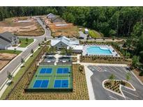 Aerial view of community amenities including pool, pickleball courts, and clubhouse at 5230 Heirloom Overlook, Cumming, GA 30040