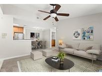Spacious living room features a ceiling fan, neutral colors, and an open floor plan at 534 Granville Ct, Atlanta, GA 30328