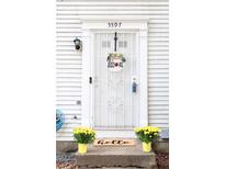 Inviting front door entrance with a welcoming wreath and doormat at 5597 Marbut Rd, Lithonia, GA 30058