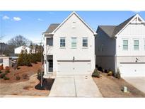 Charming two-story home with a brick facade and an attached two-car garage at 3628 Silvery Way, Powder Springs, GA 30127