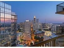 Stunning city view from balcony at night; shows lights and highrises of downtown Atlanta at 1080 Peachtree Ne St # 1906, Atlanta, GA 30309