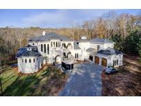 Elegant two-story home with attached garage and expansive driveway at 1628 Golden Creek Sw Ct, Conyers, GA 30094