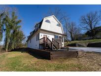 Inviting two-story home featuring a charming entryway, updated landscape, and unique architectural details at 109 Shirley Se Ln, Acworth, GA 30101