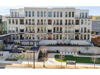 Modern building exterior, featuring multiple units with balconies and outdoor amenities at 1274 Longreen Terrace Nw # 114, Atlanta, GA 30318