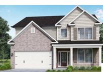 Two story house with neutral siding and a three car garage at 515 Paces Dr, Lithia Springs, GA 30122