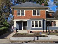 Charming two-story home with a landscaped front yard, classic architecture, and inviting entrance at 1089 Avon Sw Ave, Atlanta, GA 30310