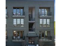 Stylish gray brick building with multiple balconies and large windows at 128 Bert Lane Se # 167, Atlanta, GA 30316