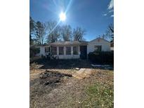 Ranch style home with a sunlit front yard at 2104 Cascade Sw Rd, Atlanta, GA 30311
