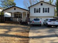 Two-story house with a covered porch and a driveway that fits two cars at 4198 Arc Way, Norcross, GA 30093