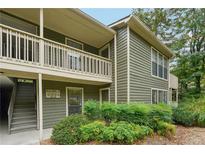 Green two-story building with balconies and landscaping at 2824 Vinings Central Se Dr # 146, Atlanta, GA 30339