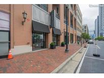 Modern building exterior with brick facade and storefront at 260 18Th St # 10320, Atlanta, GA 30363