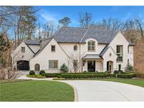 Stunning brick home with a large driveway and manicured landscaping at 5220 Green Oak Ct, Atlanta, GA 30327