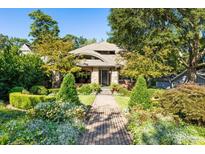 Brick house with stone accents, landscaped yard, and a walkway leading to the entrance at 2220 Edison Ave, Atlanta, GA 30305