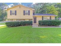 Inviting ranch home with a well-manicured lawn at 3589 Satellite Blvd, Ellenwood, GA 30294