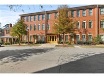 Brick building with multiple units and yellow doors at 4143 N Swann St, Covington, GA 30014