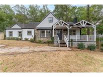 Charming craftsman style home with stone accents and a covered porch at 2711 Glenwood Se Ave, Atlanta, GA 30317