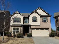 Two-story house with brick and siding, a two-car garage, and a landscaped yard at 1284 Brynhill Ct, Buford, GA 30518