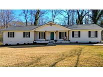 Charming single-story home with a well-manicured lawn and inviting front porch at 2622 Marcia Dr, Lawrenceville, GA 30044