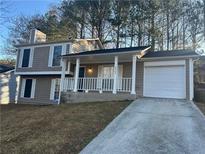 Two-story house with attached garage and front porch at 2304 Hampton Dr, Decatur, GA 30035