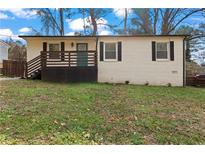 Charming one-story brick home with a cozy front porch and freshly landscaped yard at 2409 Swallow Se Cir, Atlanta, GA 30315