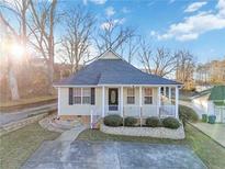 Cute ranch home with landscaped yard and charming front porch at 337 N Clayton St, Lawrenceville, GA 30046