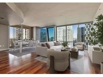 Spacious living room with hardwood floors and city views at 20 10Th Nw St # 2104, Atlanta, GA 30309
