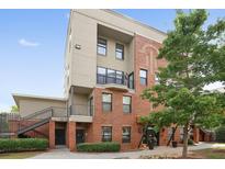 Brick building exterior with balcony and landscaping at 898 Oak St # 2003, Atlanta, GA 30310
