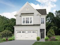 Two-story house with gray brick, white garage doors, and landscaping at 4160 Cavalier Way, Duluth, GA 30097