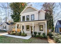 Charming two-story home with a welcoming front porch and well-maintained landscaping at 2715 Memorial Se Dr, Atlanta, GA 30317