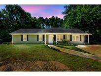 Charming single-story home featuring a well-maintained lawn and inviting curb appeal at 780 Navajo Trl, Covington, GA 30016